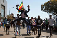 <p>Supporters of the opposition Movement for Democratic Change (MDC) party of Nelson Chamisa, sing and dance as they march in the streets of Harare, Zimbabwe, August 1, 2018. (Photo: Siphiwe Sibeko/Reuters) </p>