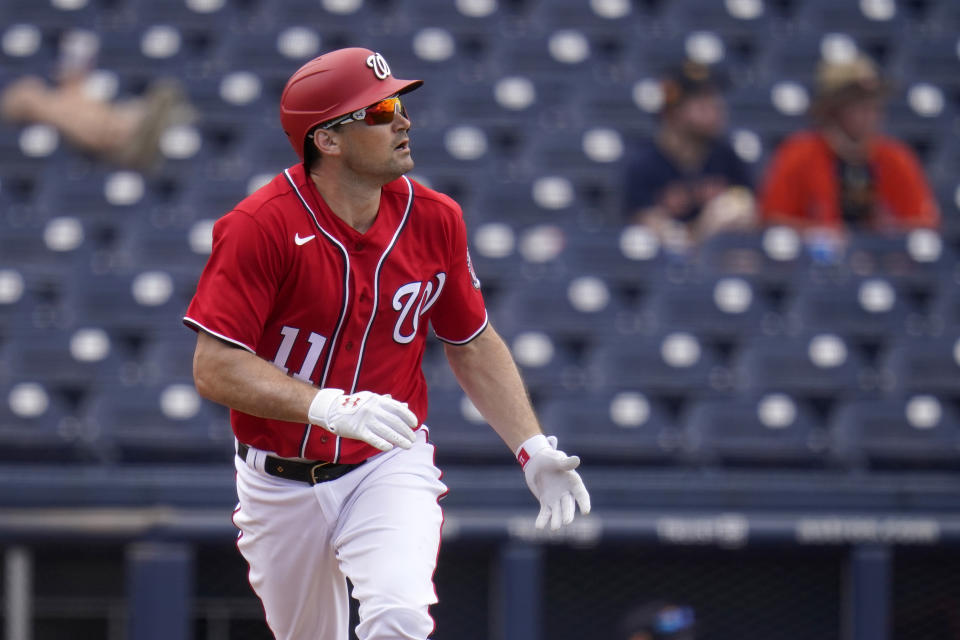 Washington Nationals' Ryan Zimmerman watches his solo home run during the third inning of a spring training baseball game against the Houston Astros Monday, March 1, 2021, in West Palm Beach, Fla. (AP Photo/Jeff Roberson)