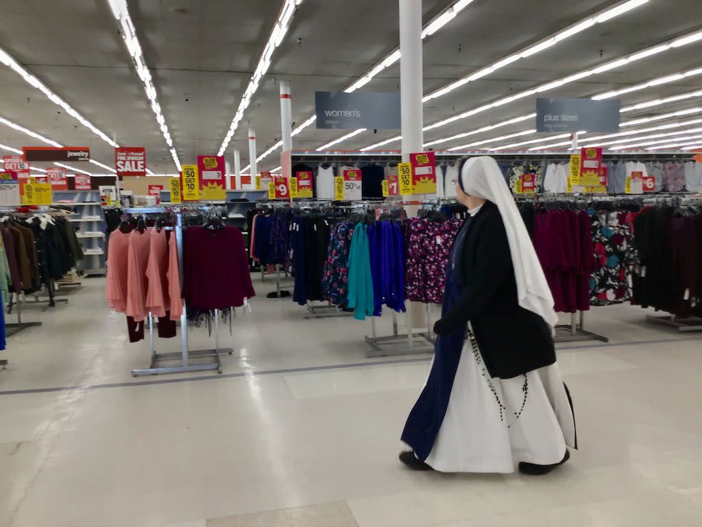 Nun walking through Silver Spring Kmart