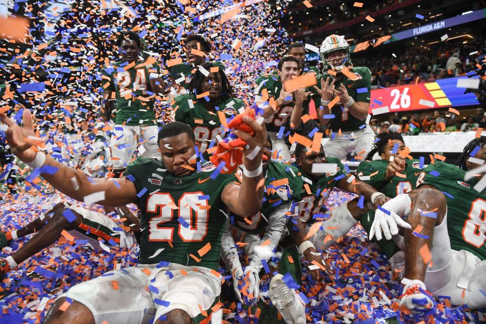 Dec. 16, 2023; Atlanta, Georgia, USA; Florida A&M athletes celebrate after the Cricket Celebration Bowl game between Florida A&M University and Howard University at Mercedes-Benz Stadium. FAMU defeated Howard 30-26. Mandatory Credit: Katie Goodale-USA TODAY Network