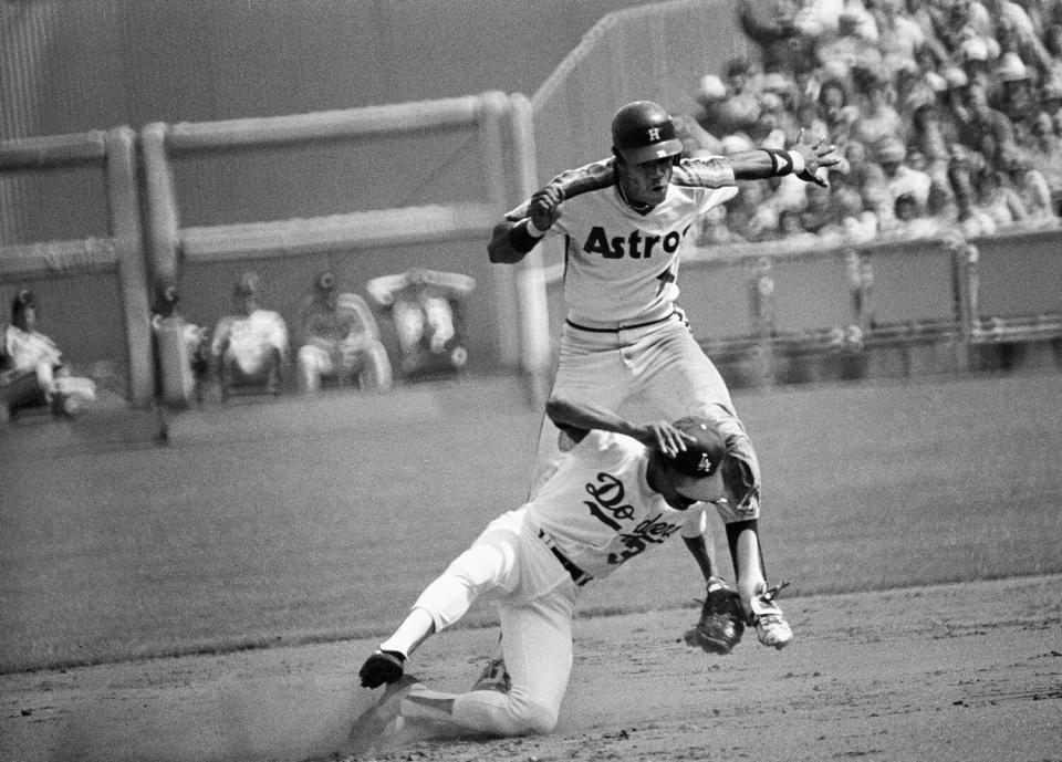 Houston's Cesar Cedeno runs into and bumps Dodgers shortstop Derrel Thomas after successfully stealing second.