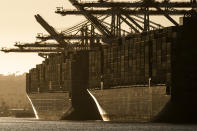 In this Tuesday, Oct. 19, 2021, photo the container ships, CMA CGM T. Rooselvelt (MT), left, and CMA CGM Panama (MT) are moored at Maersk APM Terminals Pacific at the Port of Los Angeles. California Gov, Gavin Newsom on Wednesday, Oct. 20, issued an order that aims to ease bottlenecks at the ports of Los Angeles and Long Beach that have spilled over into neighborhoods where cargo trucks are clogging residential streets. Last week the White House allowed the ports complex to become a 24-hour operation in an effort to break the logjam and reduce shipping delays. (AP Photo/Damian Dovarganes)