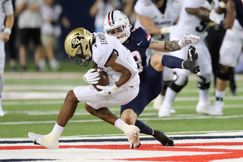 TUCSON, ARIZONA – OCTOBER 01: Wide receiver Montana Lemonious-Craig #1 of the Colorado Buffaloes is tackled by safety Gunner Maldonado #9 of the Arizona Wildcats during the second half of the NCAA football game at Arizona Stadium on October 01, 2022 in Tucson, Arizona. (Photo by Rebecca Noble/Getty Images)