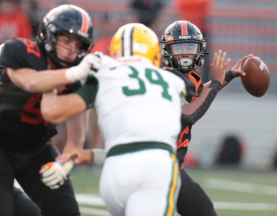 Massillon quarterback Jalen Slaughter looks to throw against St. Edward, Sept. 16, 2022.