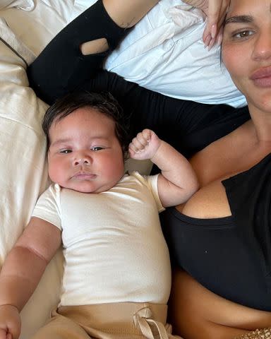 <p>Chrissy Teigen/Instagram</p> Chrissy Teigen poses next to baby Wren as seen in her latest Instagram post.