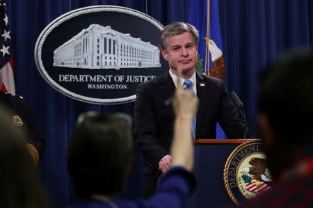 FILE PHOTO: FBI Director Christopher Wray answers questions from reporters during a news conference at the Justice Department in Washington, U.S., October 26, 2018. REUTERS/Jonathan Ernst/File Photo