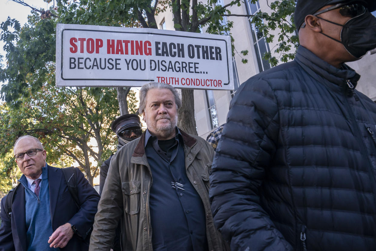 Steve Bannon, center, a longtime ally of former President Donald Trump, convicted of contempt of Congress, arrives at federal court for a sentencing hearing, Friday, Oct. 21, 2022, in Washington. Attorney David Schoen is left. (AP Photo/Nathan Howard)