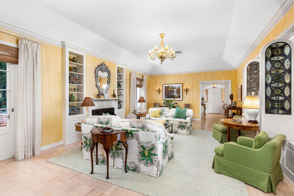 The formal living room has a gas fireplace with a built-in bookshelf on each side.