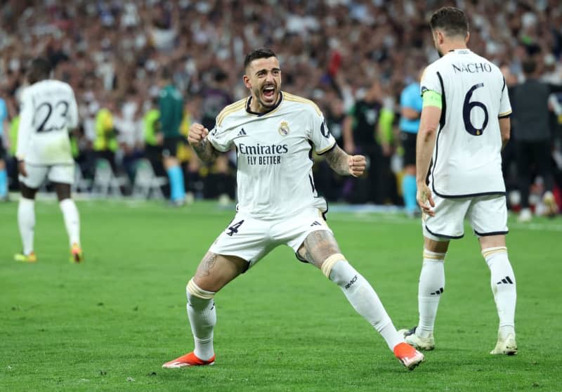 Real Madrid's Joselu celebrates scoring his side's first goal during the UEFA Champions League semi-final, second leg match between Real Madrid and Bayern Munich at the Santiago Bernabeu. Isabel Infantes/PA Wire/dpa