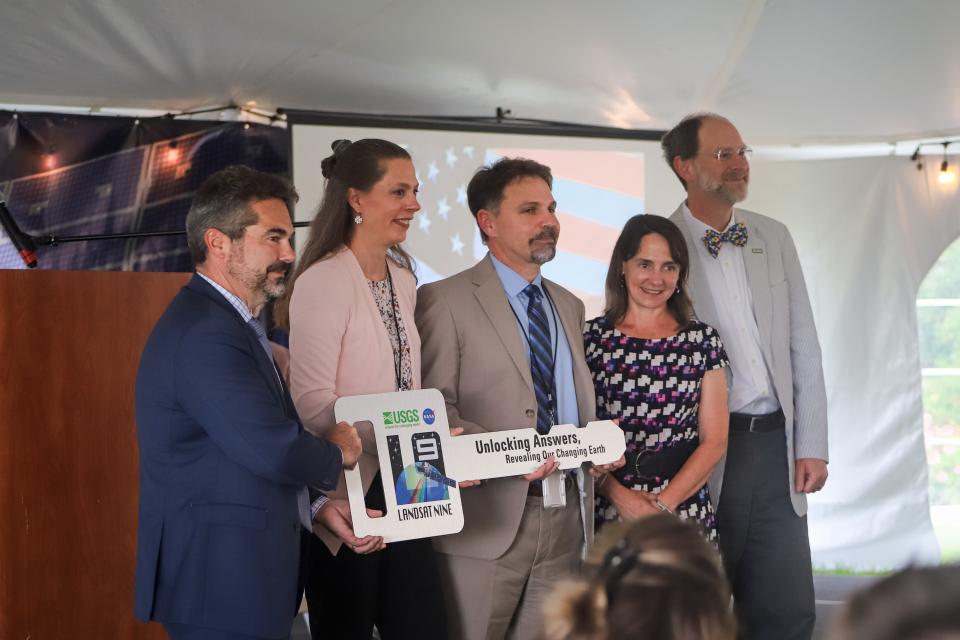 Officials with NASA and the USGS hold a ceremonial key celebrating the official transfer of power for the Landsat 9 satellite to the USGS from NASA. The ceremony was held at EROS outside Sioux Falls on Thursday, August 11.