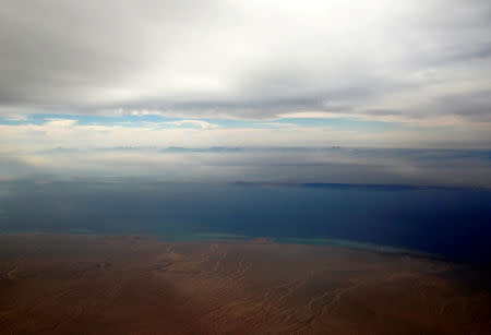 An aerial view of the coast of the Red Sea and the two islands of Tiran and Sanafir is pictured through the window of an airplane near Sharm el-Sheikh, Egypt November 1, 2016. REUTERS/Amr Abdallah Dalsh