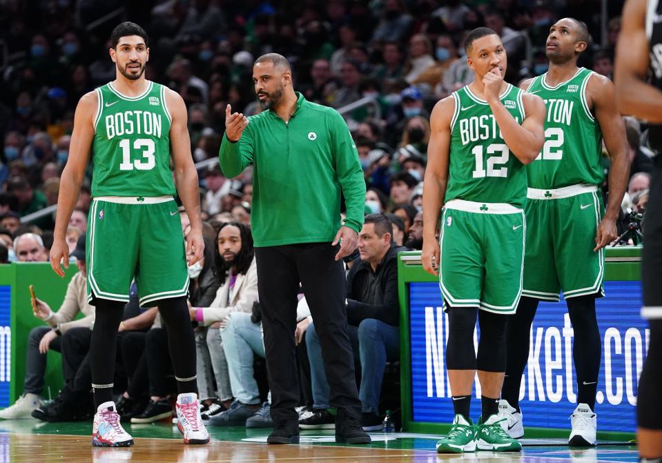 Nov 24, 2021; Boston, Massachusetts, USA; Boston Celtics head coach Ime Udoka talks with center Enes Kanter (13) from the sideline as they take on the Brooklyn Nets in the first half at TD Garden.