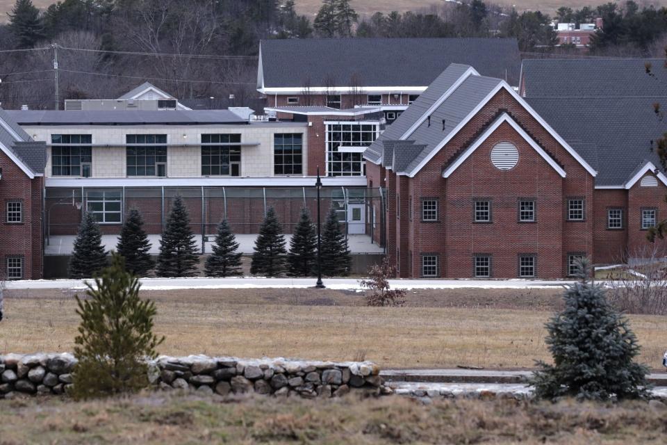 FILE — The Sununu Youth Services Center, in Manchester, N.H., stands among trees, Jan. 28, 2020. David Meehan's allegations of physical and sexual abuse at the youth detention center have led to 11 arrests and more than 700 lawsuits. Six years after he first went to police, he said in January 2023 that he is not happy with the pace of proceedings on either the criminal or civil side. (AP Photo/Charles Krupa, File)
