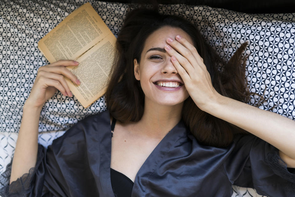 Re-reading your favourite books during COVID-19 can be a form of therapy (Image via Getty Images). 