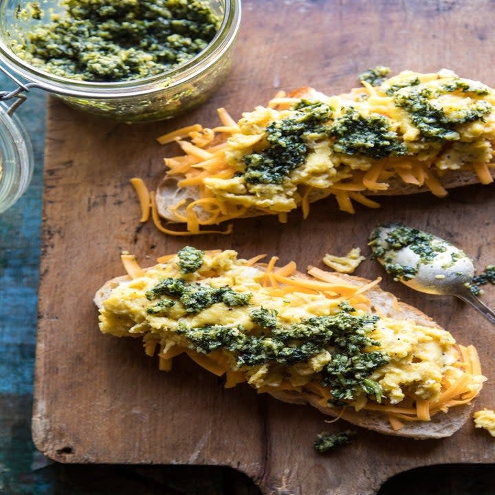 Open faced toast with scrambled eggs and pesto