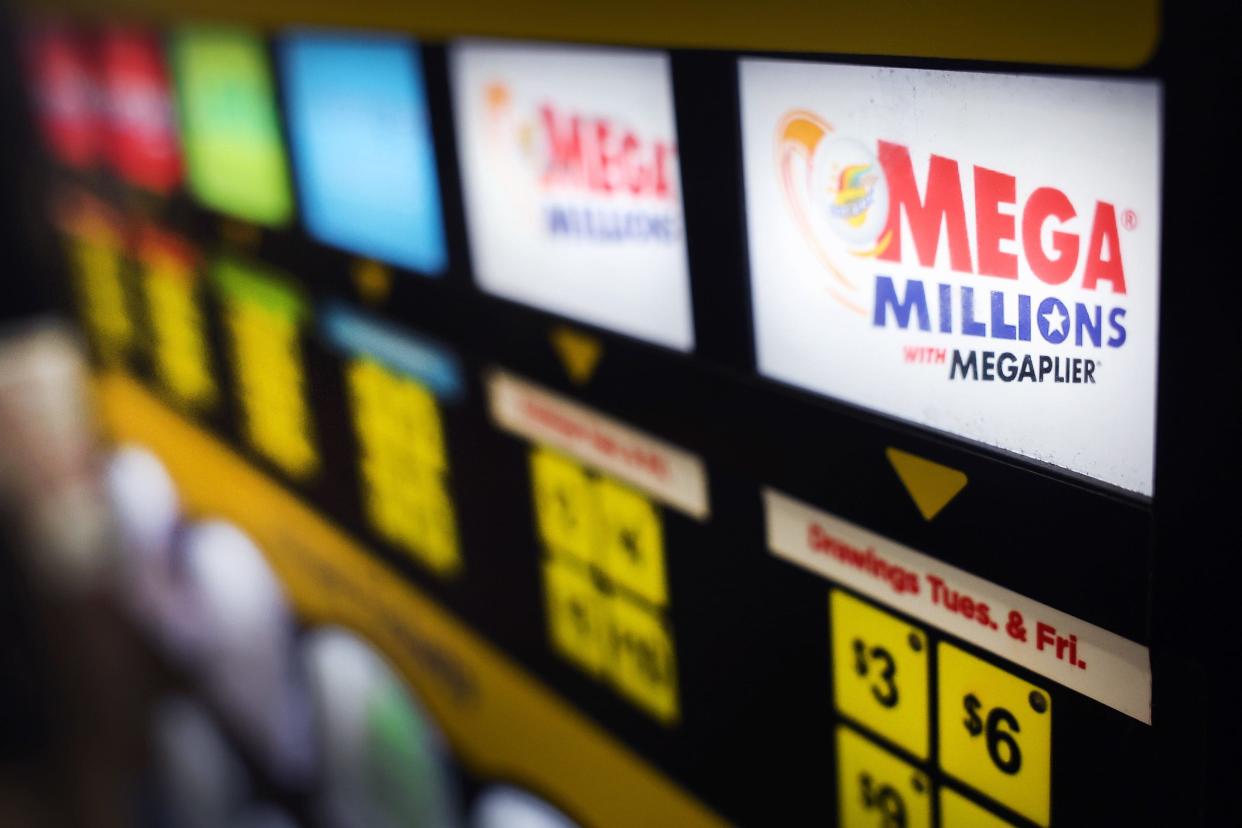 A lottery ticket vending machine offers Mega Millions tickets