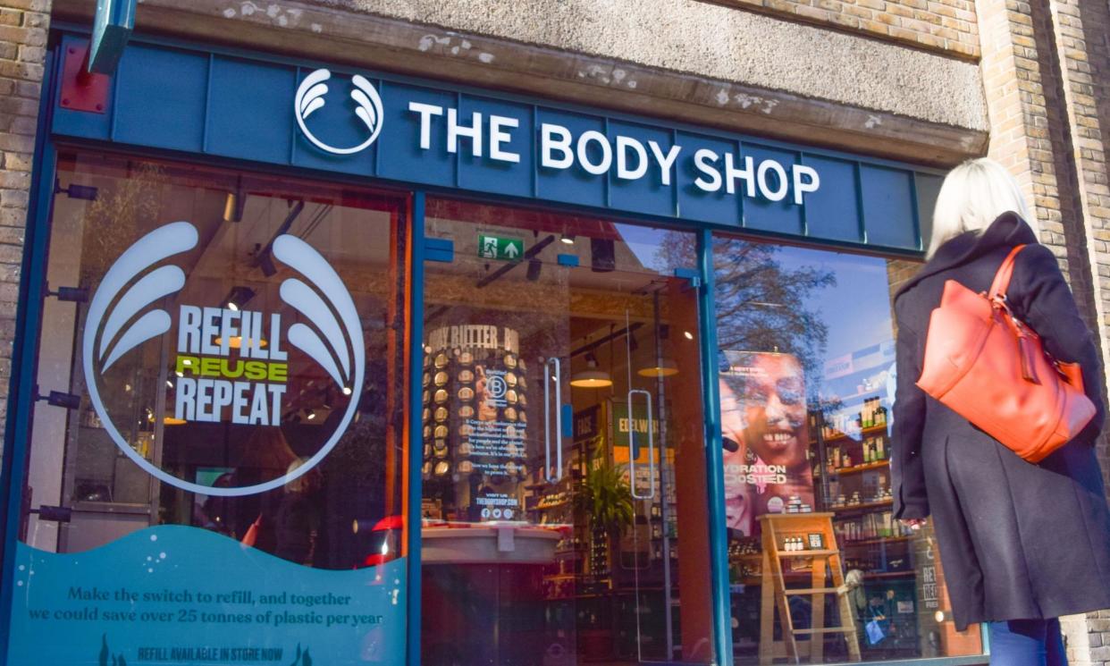 <span>A woman walks past a Body Shop store in London.</span><span>Photograph: Vuk Valcic/Sopa Images/Rex/Shutterstock</span>