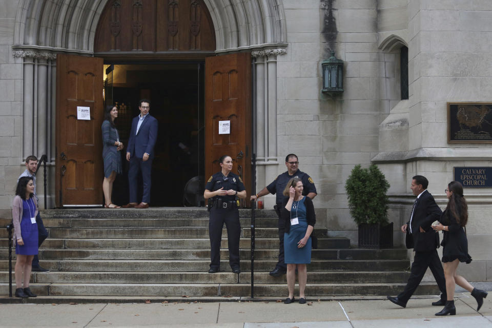 FILE - Members of the Jewish community arrive for services as Pittsburgh Police detectives provide security on the first night of Rosh Hashana at Calvary Episcopal Church in Pittsburgh, Sunday, Sept. 29, 2019. The church offered Tree of Life congregants to hold services there to accommodate the expected larger number of congregants attending Rosh Hashana services this year, after a gunman in 2018, killed 11 people at their synagogue. Ahead of the High Holidays, encompassing Rosh Hashana and Yom Kippur, that begin this week, a network of Jewish security experts and religious leaders hosted several webinars to help prepare for the season. (Rebecca Droke via AP, File)