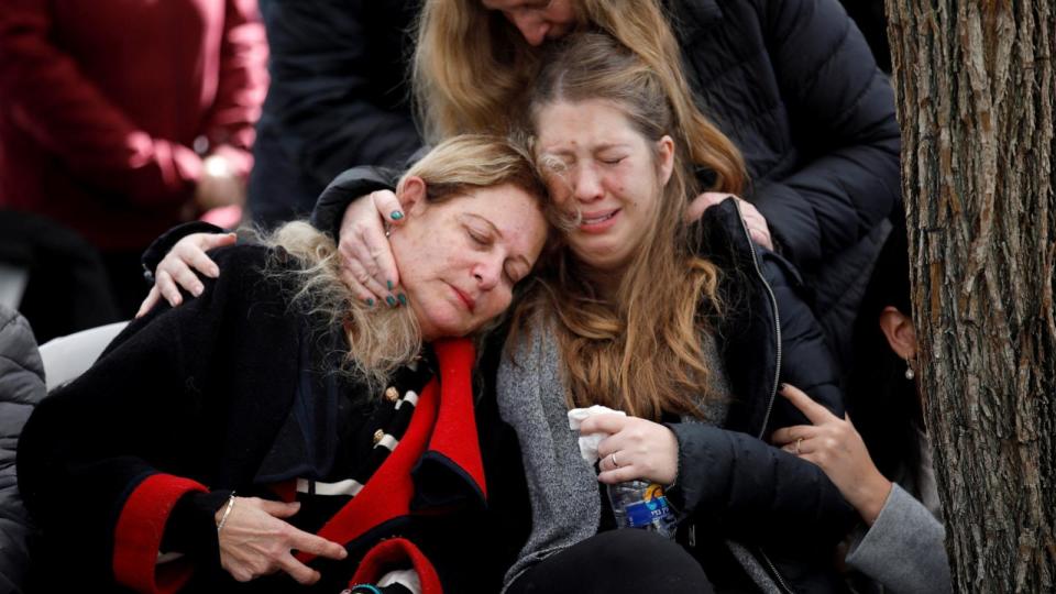 PHOTO: Women react as friends and family mourn Israeli military reservist Sergeant Major Matan Lazar, 32, who was killed in the southern Gaza Strip, at his funeral, in Haifa, Israel, Jan. 23, 2024.  (Shir Torem/Reuters)