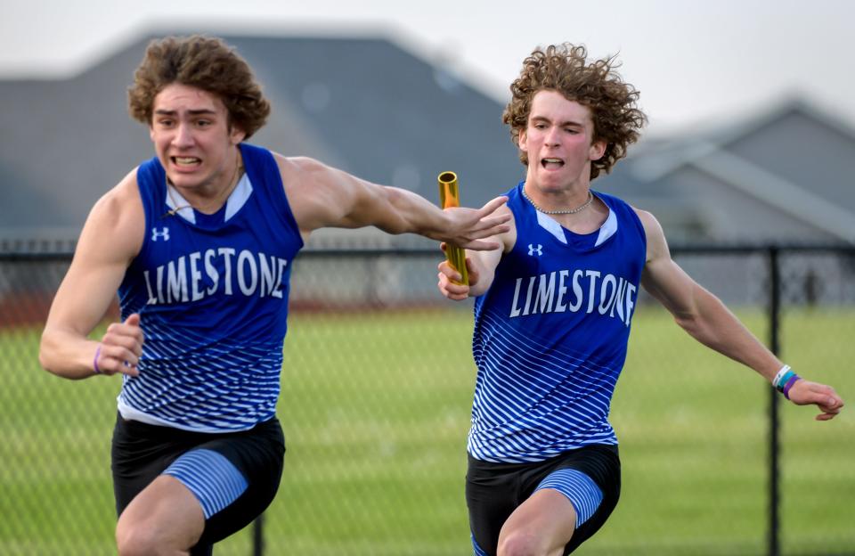 Limestone's Sam Morse, right, hands the baton off to teammate Alexander Byard in the 4X100-meter relay during the Class 2A Metamora Sectional track and field meet Wednesday, May 18, 2022 at Metamora High School. The Rockets placed second in the event, with Richwoods taking the top spot.
