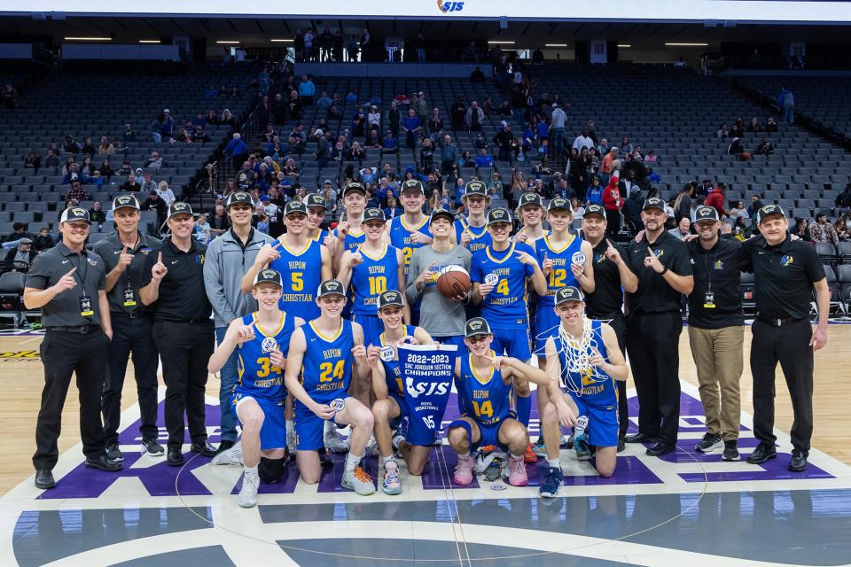 Ripon Christian Knights pose for a photo after winning the CIF Sac-Joaquin Section Division V boys basketball Championship against the Fortune Early College Panthers on Saturday, Feb. 25, 2023, at Golden 1 Center in Sacramento. The Knights won 58-54.
