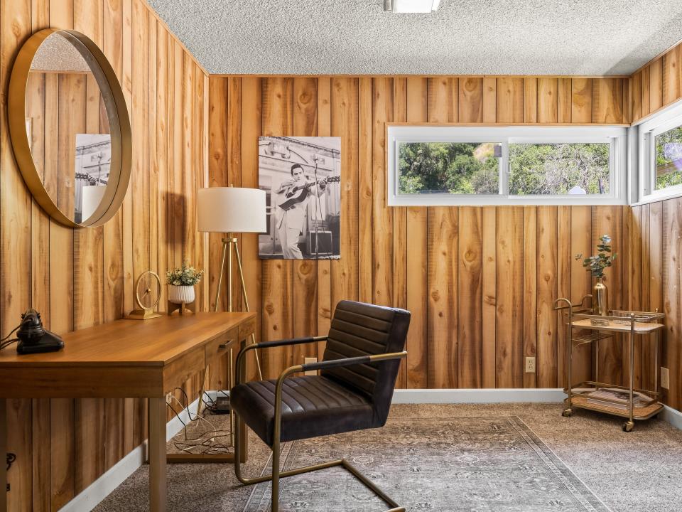 A wood-paneled studio