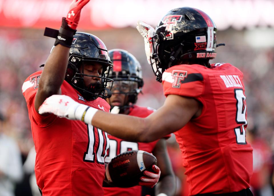 Texas Tech wide receiver Drae McCray (10) celebrates his 15-yard touchdown reception during the Red Raiders' 24-24 victory Saturday against Central Florida at Jones AT&T Stadium. Tech moved to 6-5 for the season, qualifying for bowl consideration.