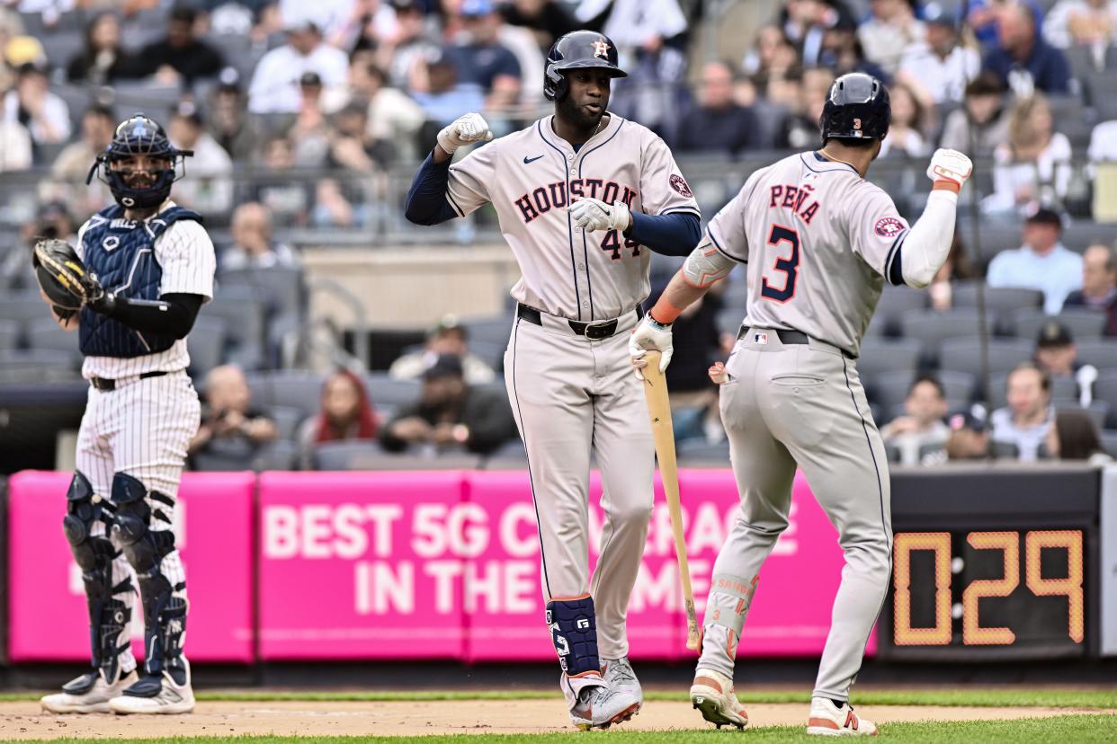 May 9, 2024; Bronx, New York, USA; Houston Astros outfielder Yordan Alvarez (44) is greeted at home plate by Houston Astros shortstop Jeremy Peña (3) after hitting a solo home run against the New York Yankees during the first inning at Yankee Stadium. Mandatory Credit: John Jones-USA TODAY Sports