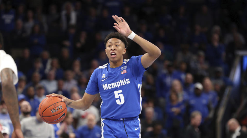 Memphis' guard Boogie Ellis (5) calls to his team in the first half of an NCAA college basketball game against Houston Saturday, Feb. 22, 2020, in Memphis, Tenn. (AP Photo/Karen Pulfer Focht)