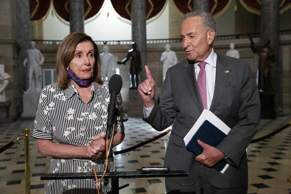 House Speaker Nancy Pelosi of Calif., left, and Senate Minority Leader Sen. Chuck Schumer of N.Y., speak to the media, Tuesday, July 28, 2020, on Capitol Hill in Washington. (AP Photo/Jacquelyn Martin)