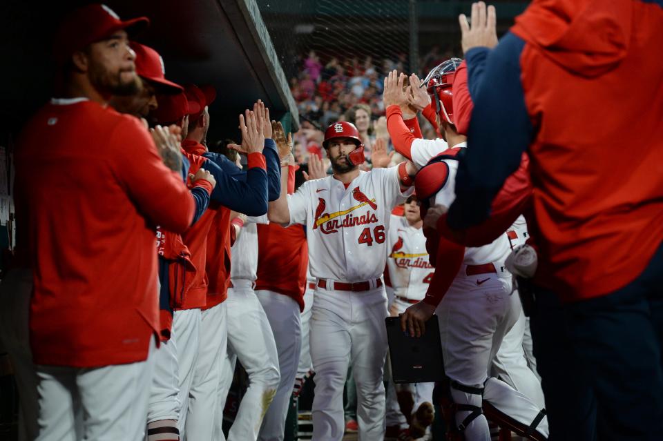 St. Louis Cardinals' Paul Goldschmidt (46) celebrates in the dugout after hitting a two-run home run during the third inning of a baseball game against the Milwaukee Brewers on Friday, May 27, 2022, in St. Louis. (AP Photo/Michael B. Thomas)