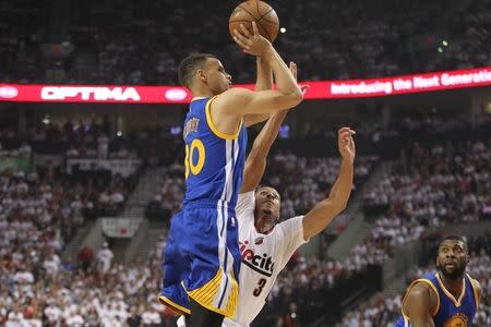 May 9, 2016; Portland, OR, USA; Golden State Warriors guard Stephen Curry (30) shoots over Portland Trail Blazers guard C.J. McCollum (3) in game four of the second round of the NBA Playoffs at Moda Center at the Rose Quarter. Mandatory Credit: Jaime Valdez-USA TODAY Sports