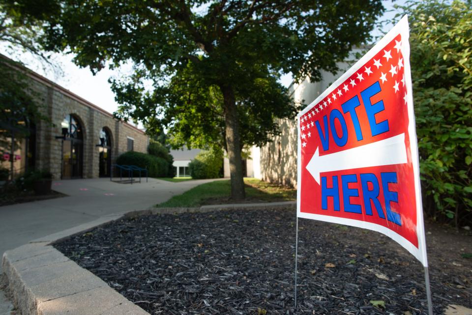Directional signs lead Shawnee County residents into Heritage Hall to cast their ballot for the primary elections Tuesday morning.