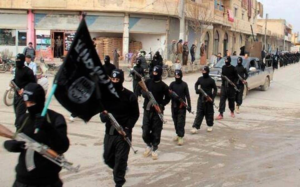 Islamic State fighters march through Raqqa, Syria, before they were ejected by Coalition forces. Jan 14, 2014. - Militant Website