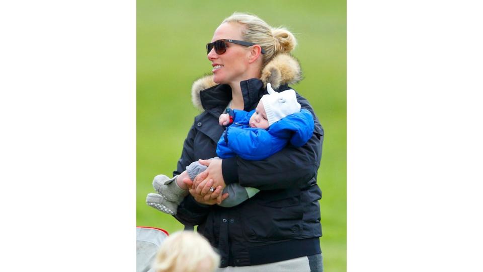 Zara Tindall carrying a baby Mia Tindall