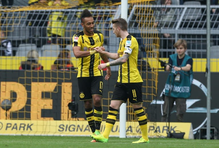 Dortmund's forward Pierre-Emerick Aubameyang (L) celebrate scoring the 2-0 goal with Dortmund's forward Marco Reus during the German First division Bundesliga football match between Borussia Dortmund and Bayer 04 Leverkusen on March 4, 2017