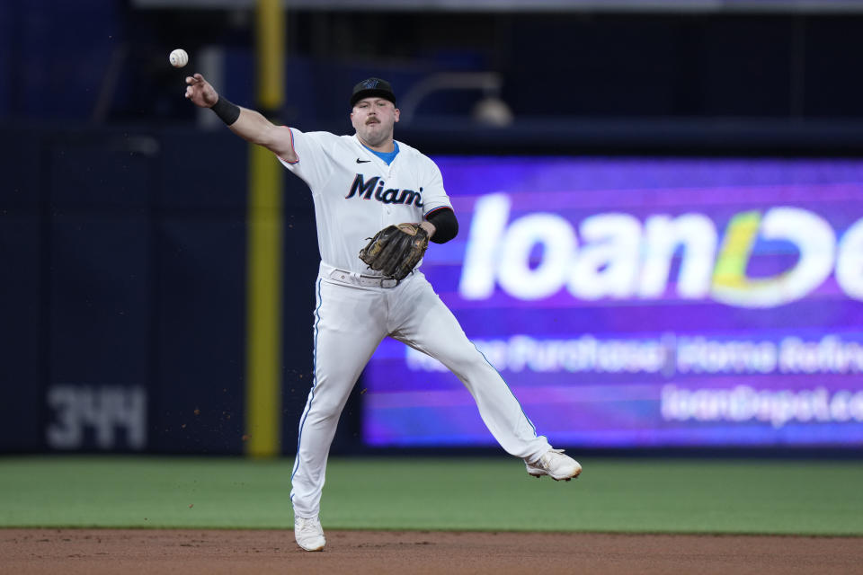 Miami Marlins third baseman Jake Burger throws to first to put out Los Angeles Dodgers' Will Smith during the first inning of a baseball game, Tuesday, Sept. 5, 2023, in Miami. (AP Photo/Wilfredo Lee)