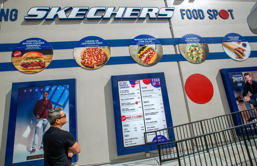 GARDENA, CA-SEPTEMBER 30, 2023:A customer checks out the menu at Sketchers Food Spot in Gardena. Sketchers Food Spot is a food court attached to a Sketchers shoe outlet. (Mel Melcon / Los Angeles Times)