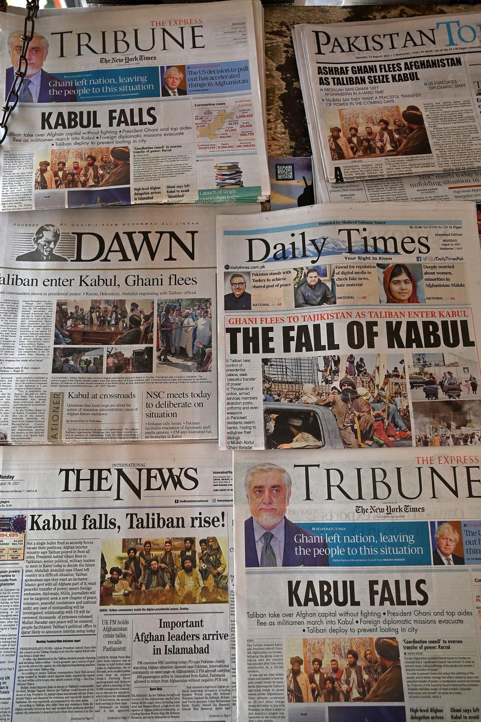 Pakistan's newspapers are pictured displaying front page news about Afghanistan, at a stall in Islamabad