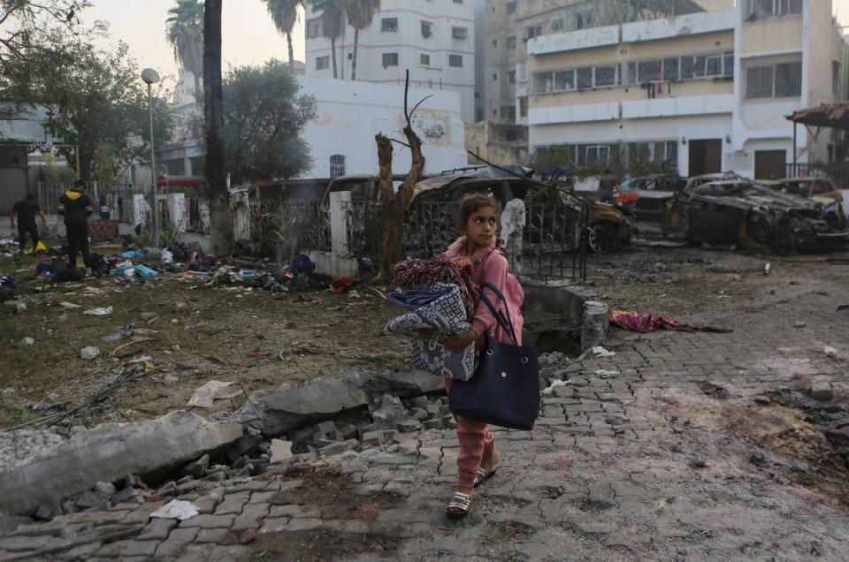 Hundreds of Palestinians were sheltering with their family in the Al Ahli Hospital after being displaced (AP)