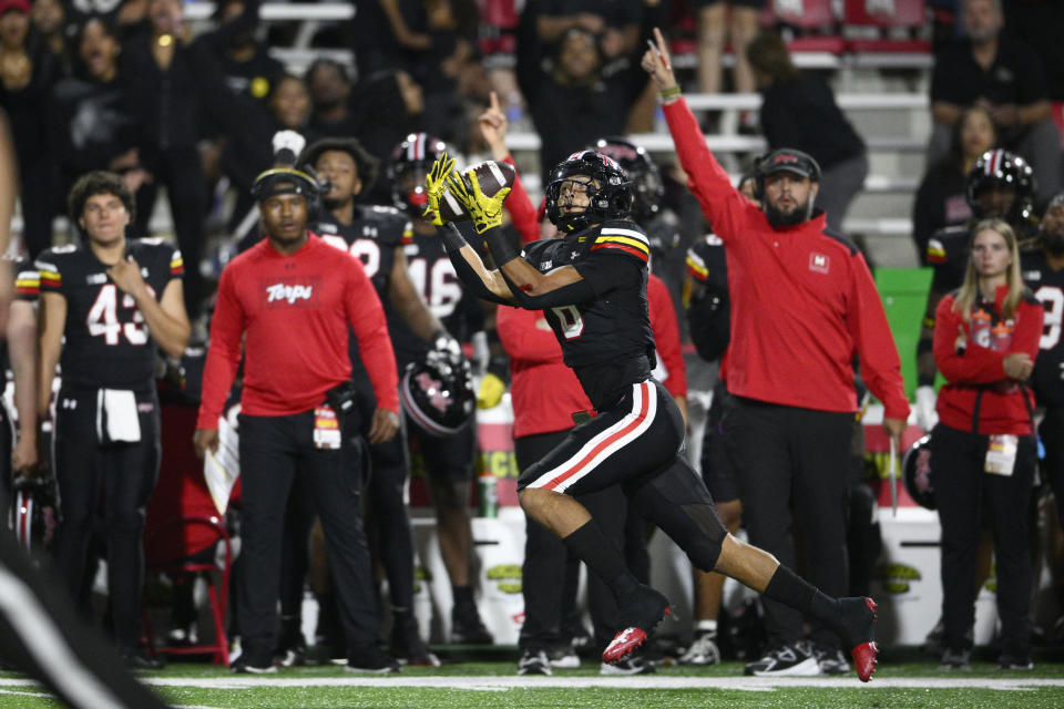 Maryland wide receiver Jeshaun Jones makes a catch en route to scoring a touchdown against Virginia during the second half of an NCAA college football game Friday, Sept. 15, 2023, in College Park, Md. (AP Photo/Nick Wass)