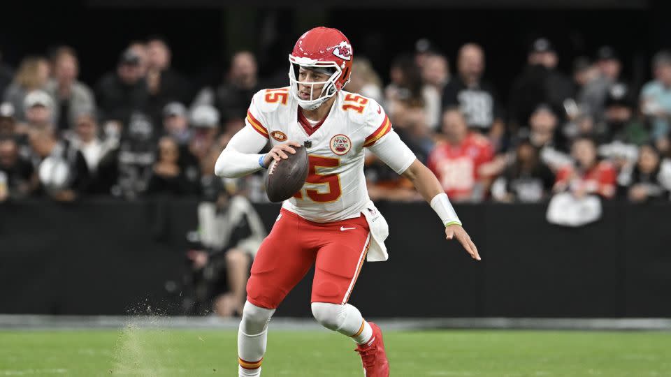 Mahomes runs the ball in the third quarter against the Las Vegas Raiders. - Candice Ward/Getty Images