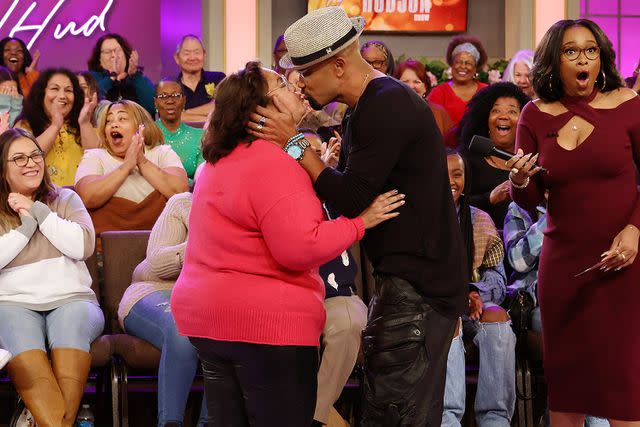 <p>Chris Millard/Warner Bros.</p> Shemar Moore kissing a fan on 'The Jennifer Hudson Show'.