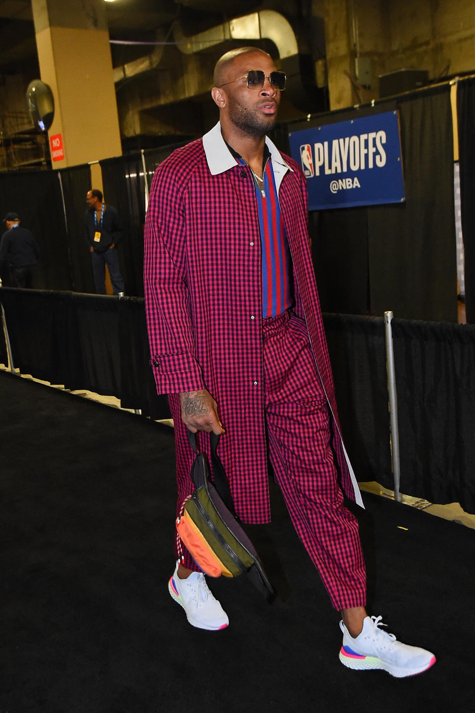 PJ Tucker of the Houston Rockets wears a checkered ensemble paired with Nike Epic React Flyknit 2 on April 30, 2019.