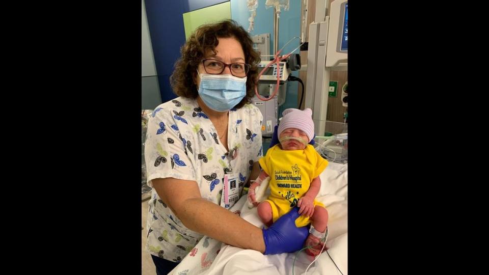 Dawn Horowitz, a registered nurse at Salah Foundation Children’s Hospital in Coral Springs, helps care for Caleb Joseph Reigh in the Neonatal Intensive Care Unit. Caleb was born just after midnight at 12:04 a.m. on Jan. 1, 2021, making him the first “new year” baby born at Broward Health.