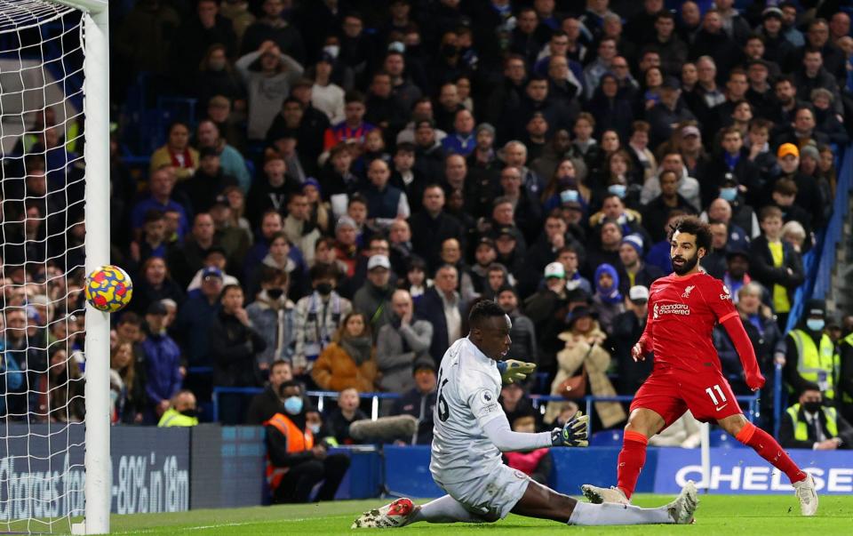 Mohamed Salah of Liverpool scores their side's second goal during the Premier League match between Chelsea and Liverpool - Getty Images