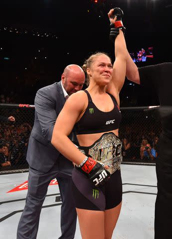 <p>Josh Hedges/Zuffa LLC/Zuffa LLC via Getty </p> Ronda Rousey celebrating a win in August 2015