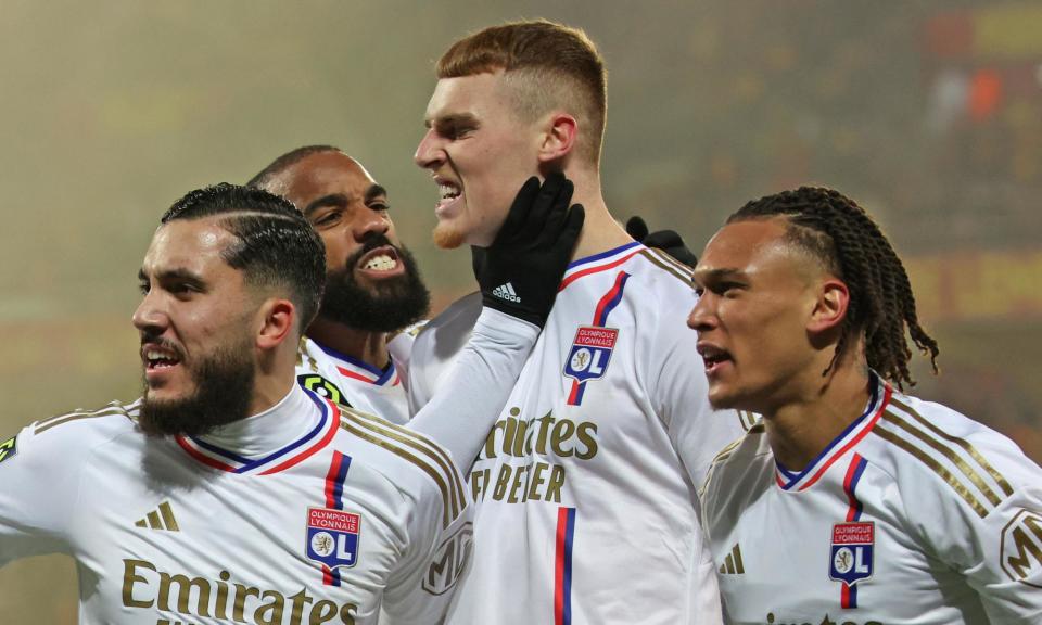 <span>Jake O'Brien (centre) celebrates with teammates after scoring for Lyon against Lens last season. </span><span>Photograph: François Lo Presti/AFP/Getty Images</span>