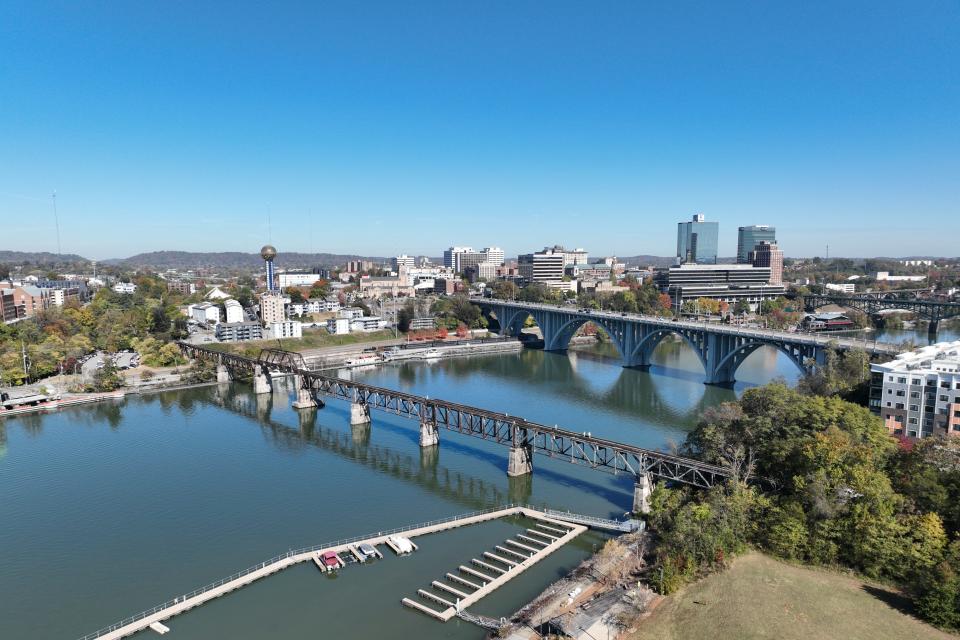 Aerial view of the Norfolk train bridge, Maplehurst apartments, Downtown Knoxville, and the Tennessee River in Knoxville, Tenn. on October 25, 2023.