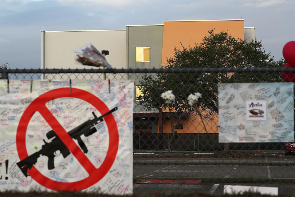 <p>A sign is seen on the fence around Marjory Stoneman Douglas High School in front of the freshman dorm where a mass shooting took place on campus on February 23, 2018 in Parkland, Fla. (Photo: oe Raedle/Getty Images) </p>